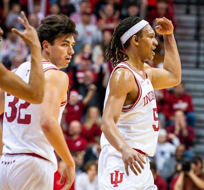 Indiana's Malik Reneau (5) holds up three fingers after making a three-pointer during the first half of the Indiana versus North Alabama men's basketball game at Simon Skjodt Assembly Hall on Thursday, December 21, 2023.